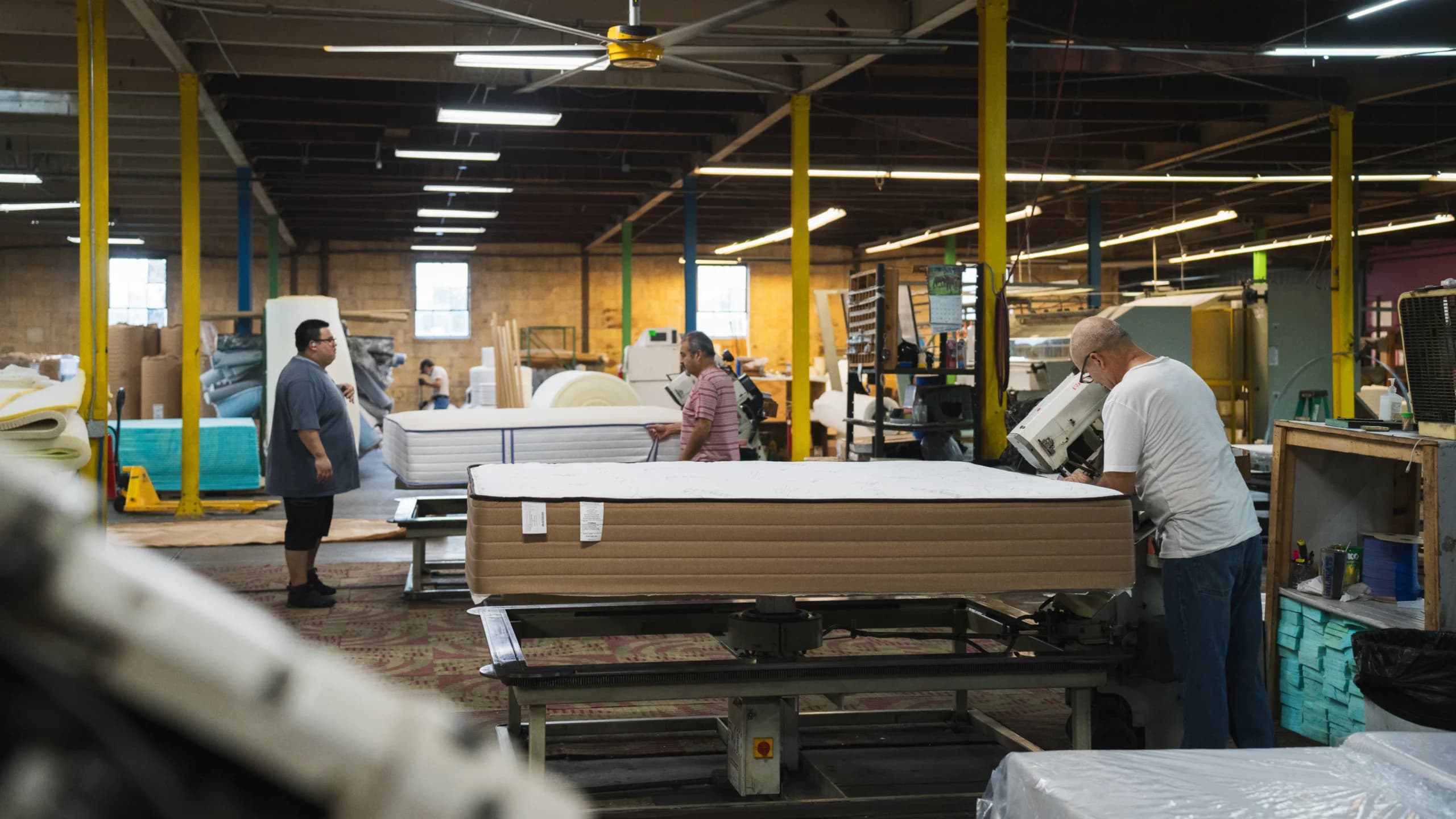 Expert craftsmen at Texas Mattress Makers hard at work