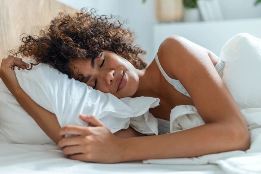 Woman sleeping on a cooling mattress