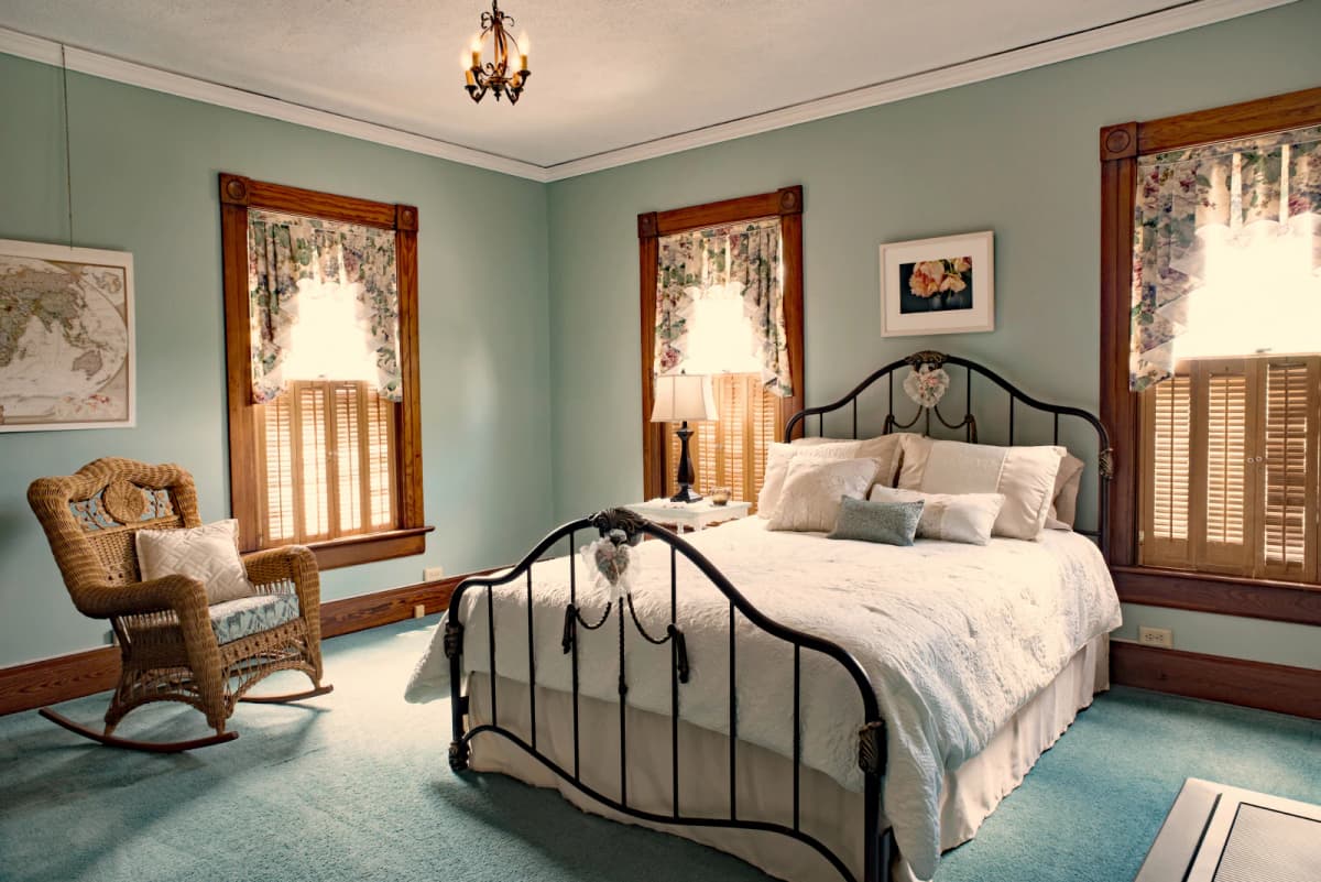 Antique bed frame in old-timey room