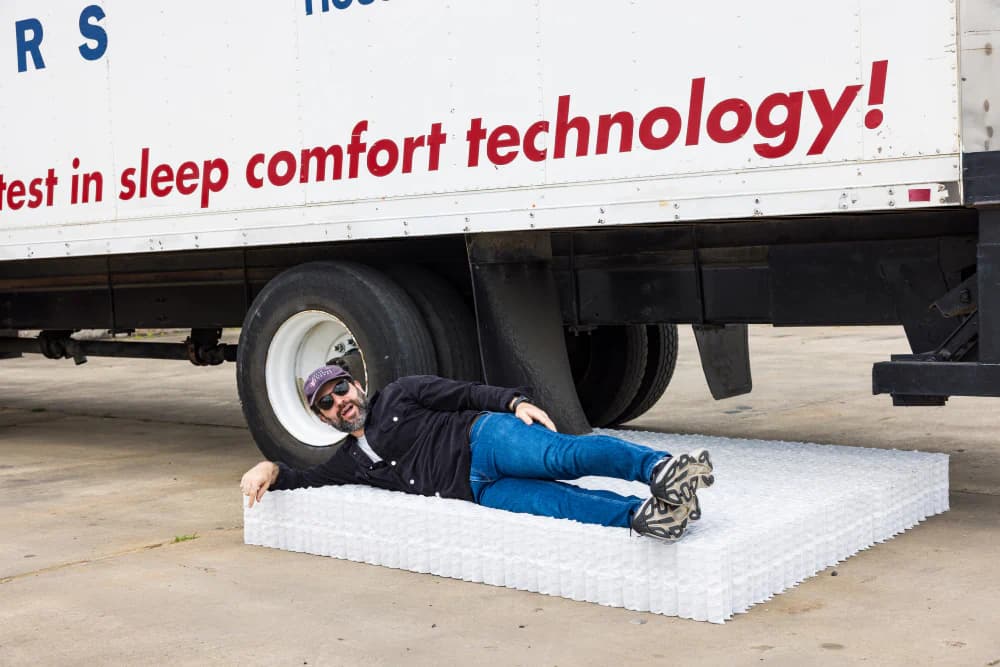Noah from Texas Mattress Makers lying on the Quantum™ Coil component