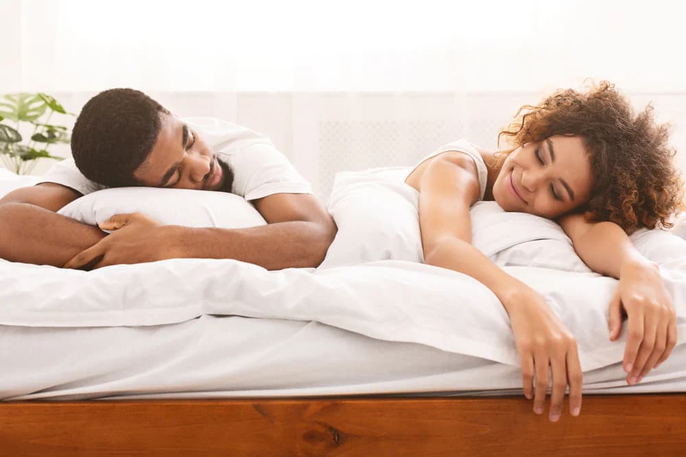 Couple relaxing on their mattress