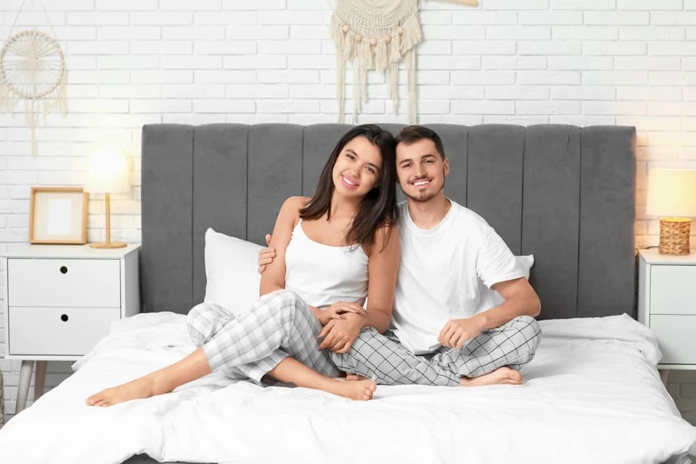 Smiling couple on a sustainable mattress