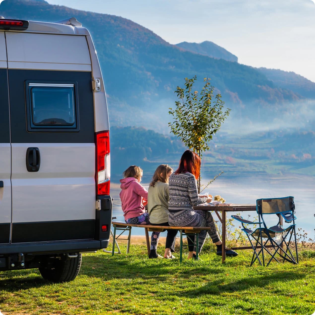 Family outside van with custom TMM mattress