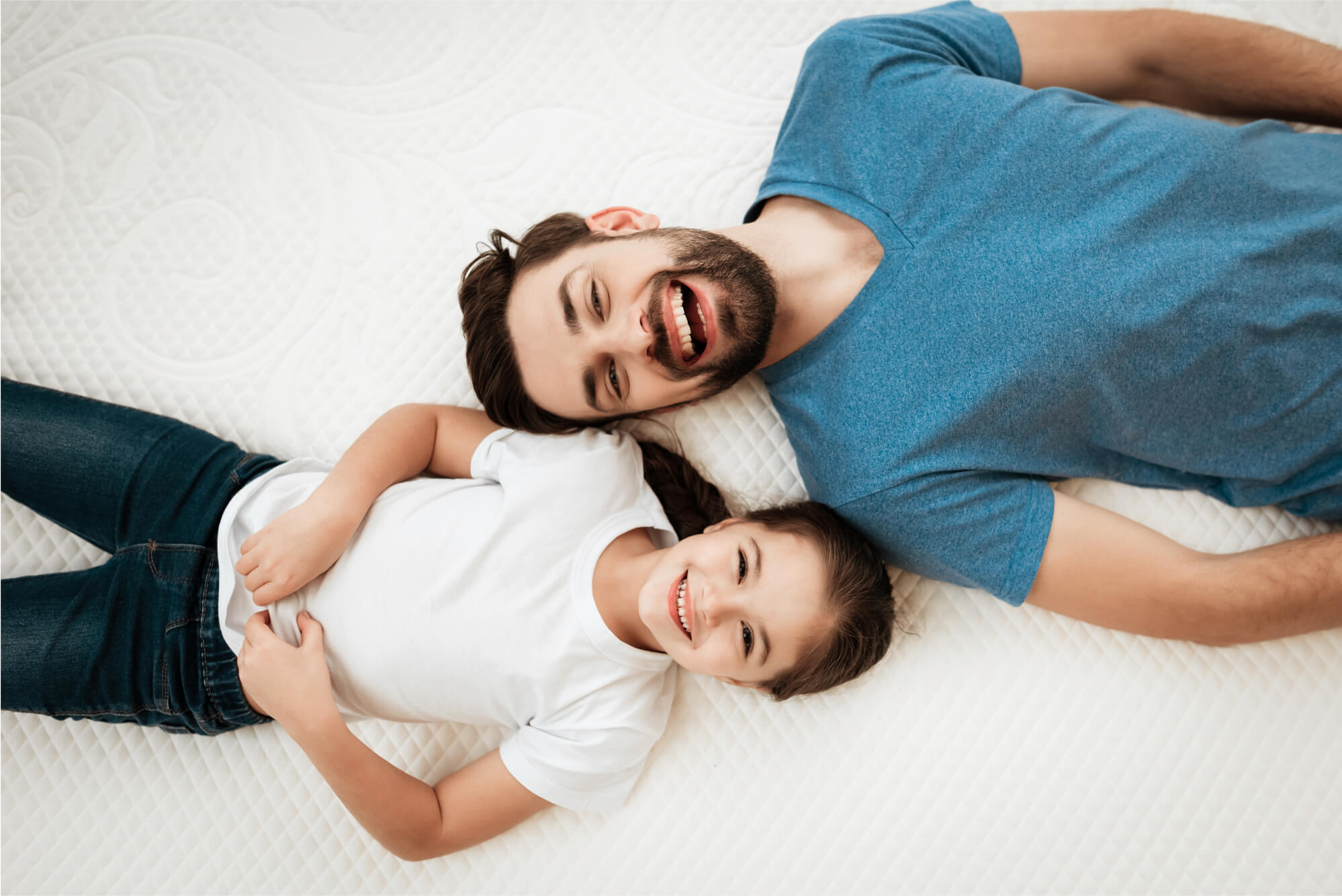 Father and son on bed