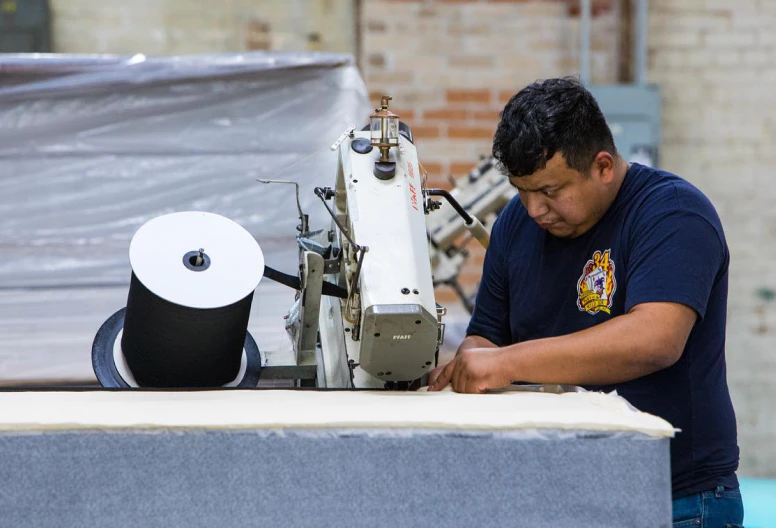 Texas Mattress Makers craftsmen making a mattress