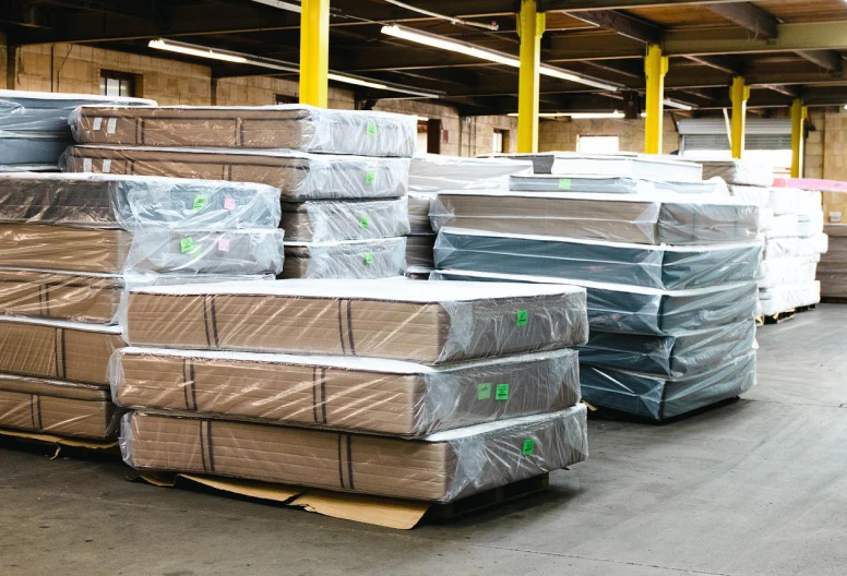 Mattresses stacked in the Texas Mattress Makers factory