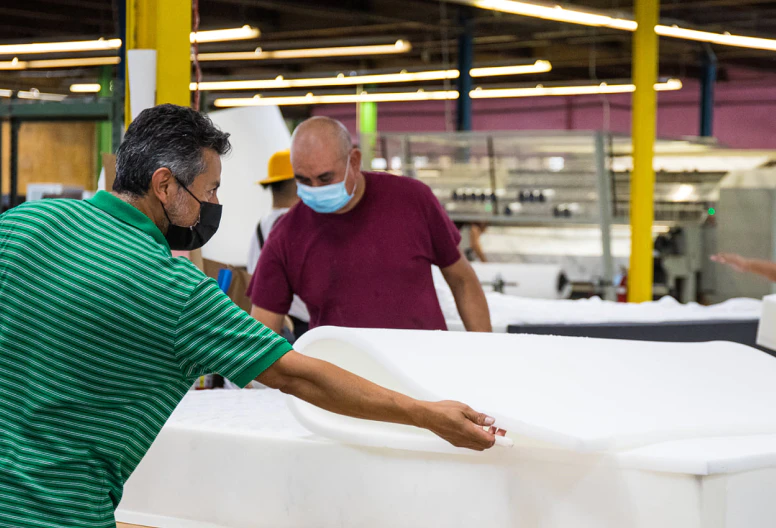 Texas Mattress Makers craftsmen making mattresses in the factory