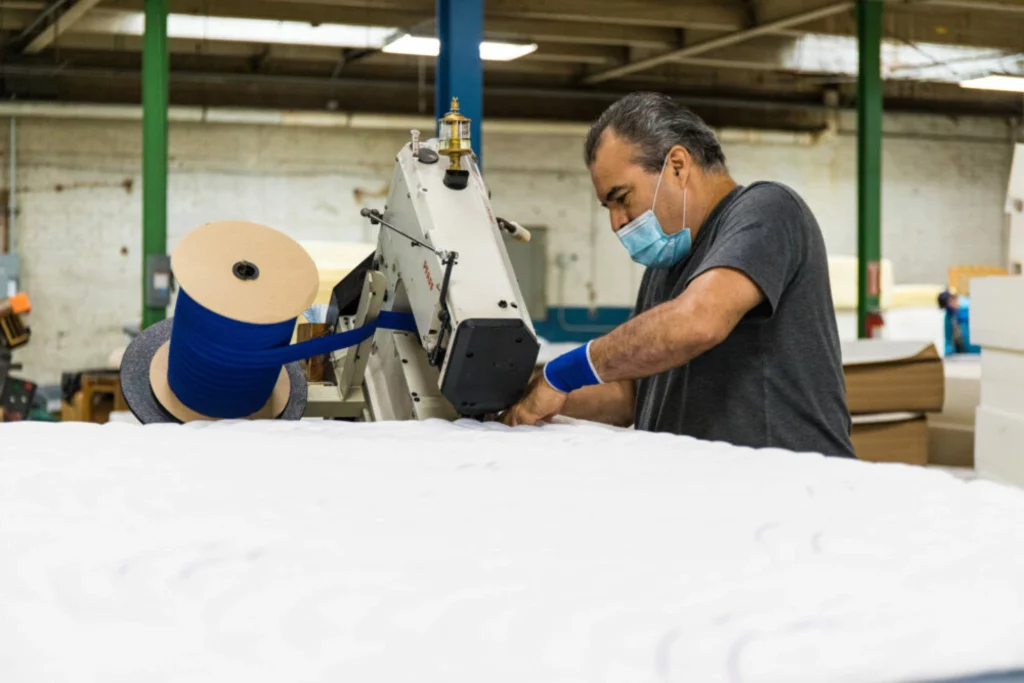 Texas Mattress Makers Handmaking mattresses in factory